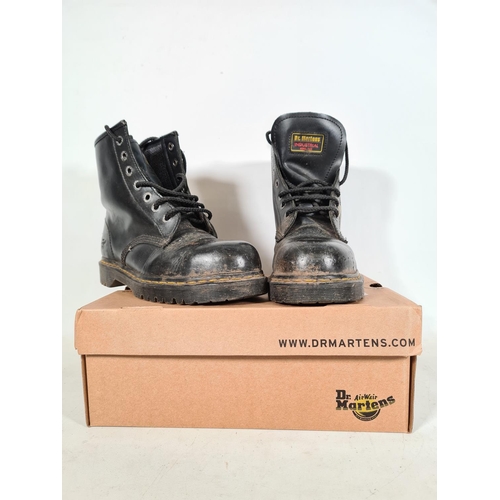 526 - A pair of new Dr Martens black leather steel toe capped size 7 boots