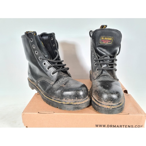 526 - A pair of new Dr Martens black leather steel toe capped size 7 boots