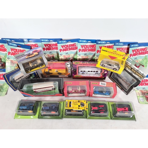 539 - A collection of boxed die cast vehicles to include ERTL Young Farmer accessories, Corgi Classics Mac... 