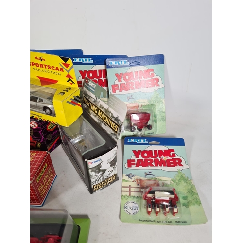 539 - A collection of boxed die cast vehicles to include ERTL Young Farmer accessories, Corgi Classics Mac... 