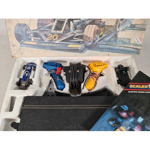 559 - A boxed Scalextric 200 set complete with two controllers, two cars, tracks and instruction manual