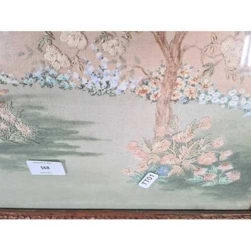 568 - A Victorian gilt framed painting on linen and embroidery of a woodland scene - approx. 60cm x 50cm i... 