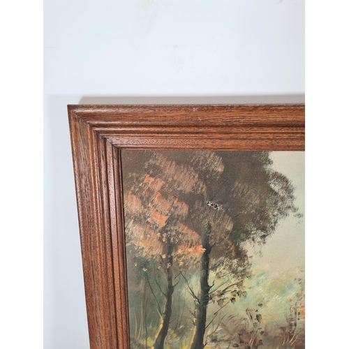 577 - A oak framed oil on canvas of a forest scene signed lower left - approx. 100cm x 54cm including fram... 