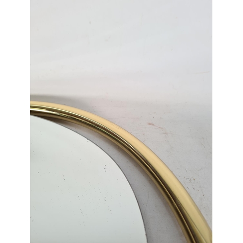 578 - A brass framed bevelled edge wall mirror - approx. 91cm x 62cm