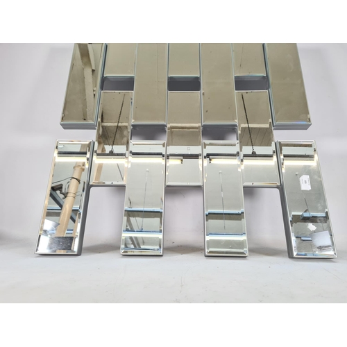 585 - A contemporary bevelled edge wall mirror - approx. 101cm x 70cm