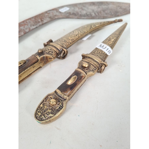 605 - Three knives to include one Syrian brass & antler Jambiya/dagger with brass sheath and curved steel ... 