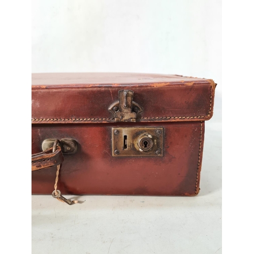 616 - A vintage brown leather suitcase - approx. 16cm high x 50cm wide x 30cm deep