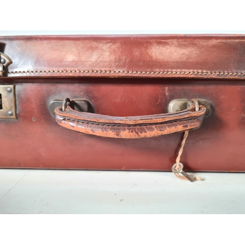 616 - A vintage brown leather suitcase - approx. 16cm high x 50cm wide x 30cm deep