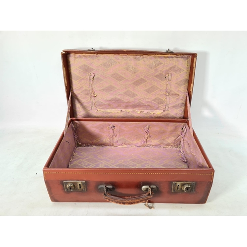 616 - A vintage brown leather suitcase - approx. 16cm high x 50cm wide x 30cm deep