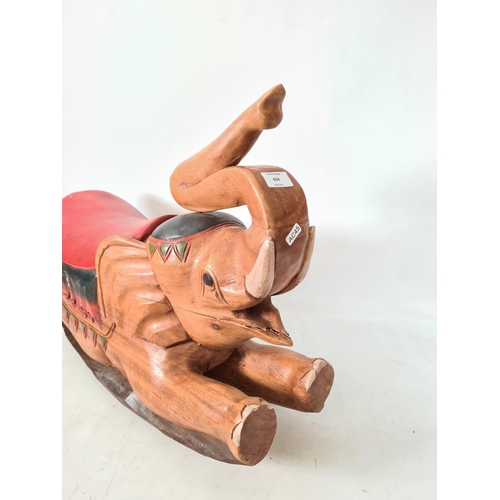 634 - A modern carved wooden elephant child's rocking seat