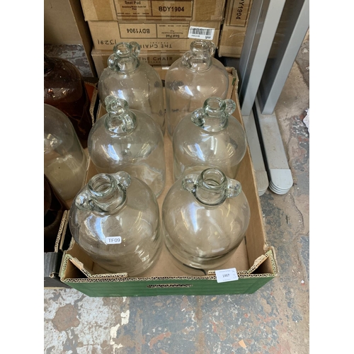 1467 - Three boxes containing brown and clear glass demijohns and modern vases