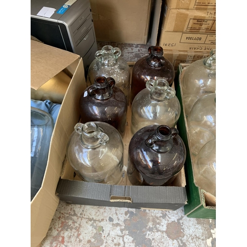 1467 - Three boxes containing brown and clear glass demijohns and modern vases