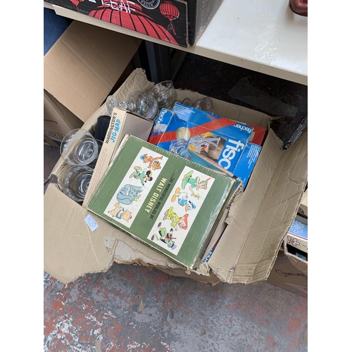 1472 - Two boxes containing vintage jigsaw puzzles, Monopoly board game, boxe set of four Walt Disney books... 