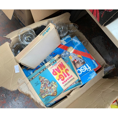 1472 - Two boxes containing vintage jigsaw puzzles, Monopoly board game, boxe set of four Walt Disney books... 