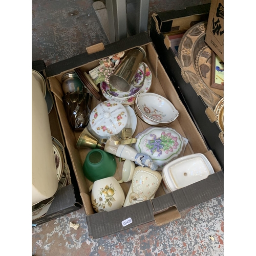 1486 - Ten boxes containing various items to include mixed ceramics, glassware, breadbin, vintage Head tenn... 