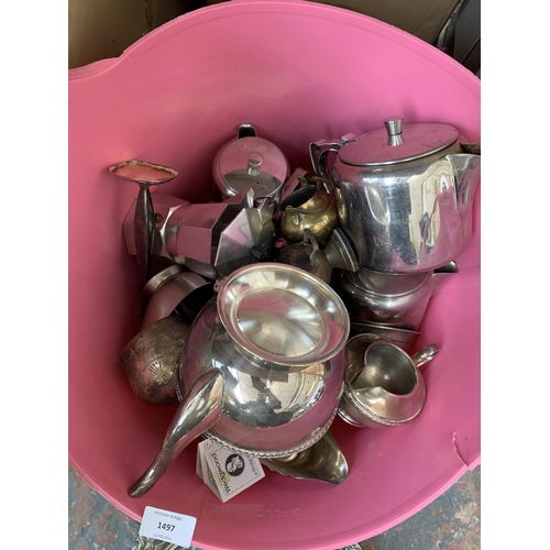 1497 - A pink plastic bucket containing a large quantity of mixed metalware