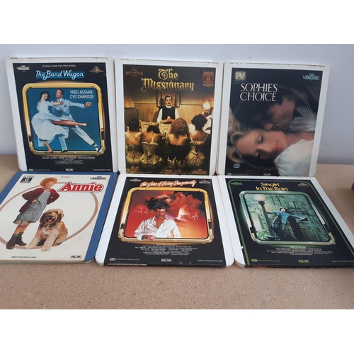 1090 - A box containing seventeen vintage LaserDiscs, The Long Good Friday, Bugsy Malone, The French Lieute... 