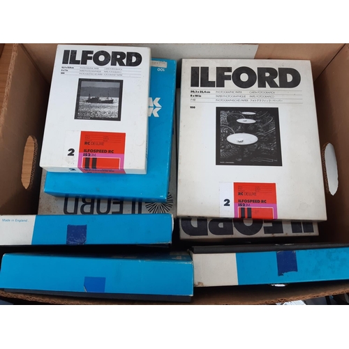 1192 - A large quantity of photography equipment to include Durst F30 enlarger, Ilford photography paper, P... 