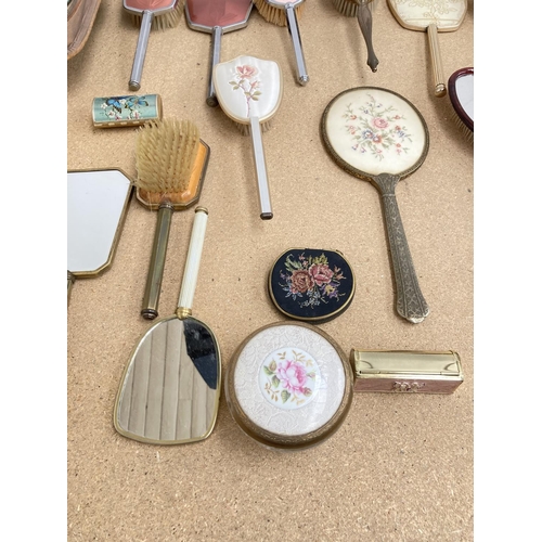 608 - Thirty assorted vintage ladies vanity items and accessories to include brushes, gloves etc.