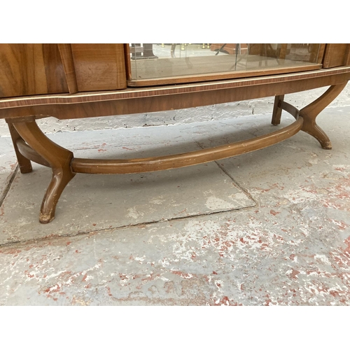 644 - A 1950s Beautility walnut sideboard with concealed revolving cocktail cabinet - approx. 80cm high x ... 