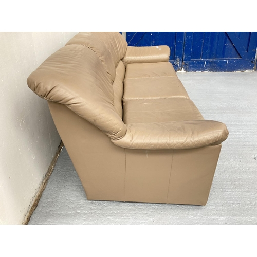 794 - A modern brown leather three seater sofa