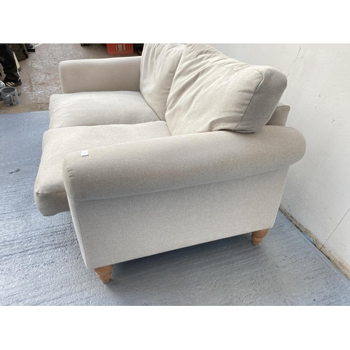 795 - A Next grey upholstered two seater sofa