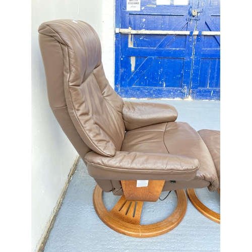 797 - A Stressless style brown leather swivel armchair with matching footstool