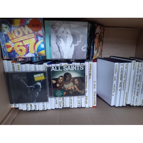 1100 - Two boxes containing a large quantity of CDs and DVDs, CDs to include Eric Clapton, Now 67, All Sain... 