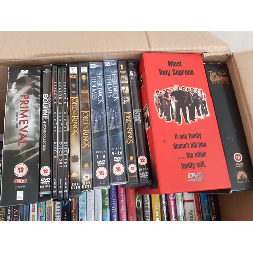 1100 - Two boxes containing a large quantity of CDs and DVDs, CDs to include Eric Clapton, Now 67, All Sain... 