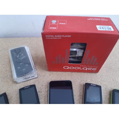 1013 - A box containing personal media devices to include three Sony Walkman digital media players (NWZ-A81... 