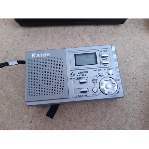 1015 - A box containing radios to include Roberts New Classic 993 three band, cased Grundig Traveller II se... 