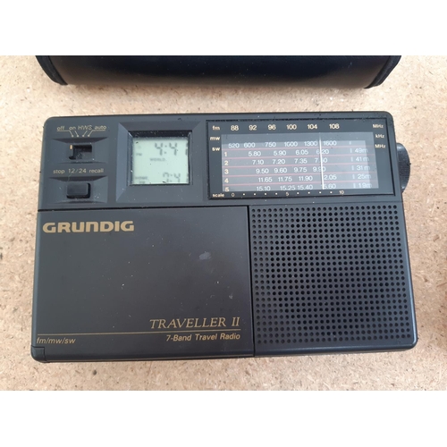 1015 - A box containing radios to include Roberts New Classic 993 three band, cased Grundig Traveller II se... 