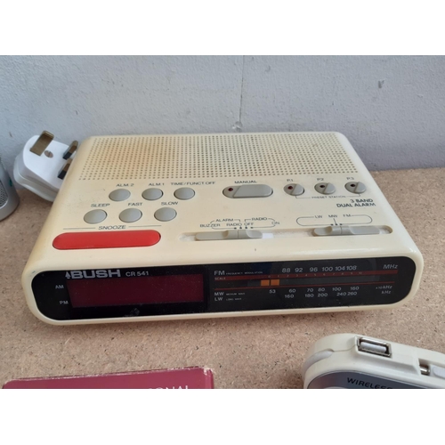 1015 - A box containing radios to include Roberts New Classic 993 three band, cased Grundig Traveller II se... 