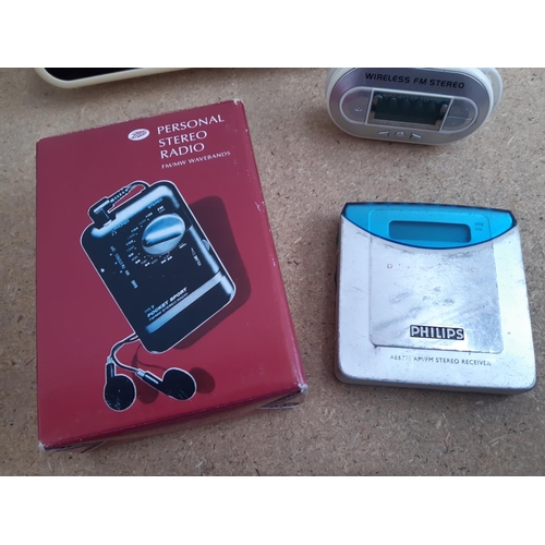 1015 - A box containing radios to include Roberts New Classic 993 three band, cased Grundig Traveller II se... 