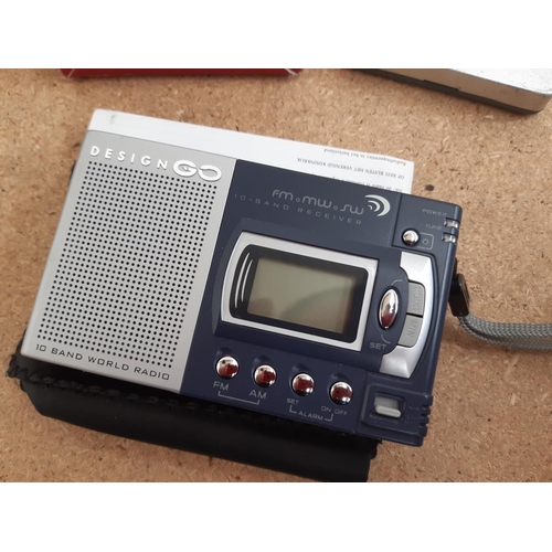 1015 - A box containing radios to include Roberts New Classic 993 three band, cased Grundig Traveller II se... 