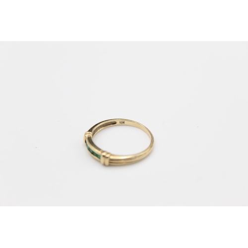 10 - A 9ct gold emerald single row ring, size O  - approx. gross weight 1.6 grams
