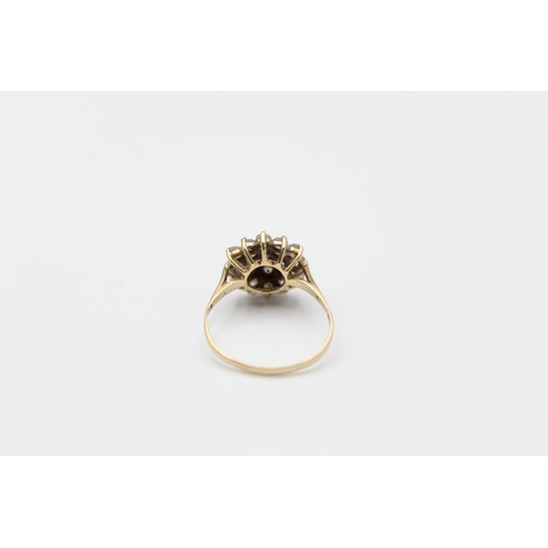 45 - A 9ct gold gemstone cluster ring, size Q ½ - approx. gross weight 2.5 grams
