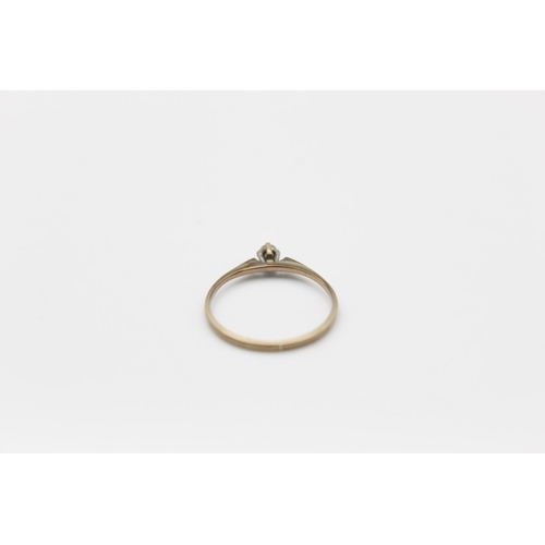81 - A 9ct gold diamond solitaire ring, size K -approx. gross weight 0.7 grams