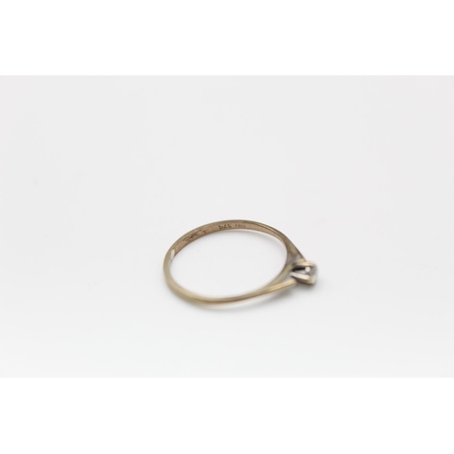 81 - A 9ct gold diamond solitaire ring, size K -approx. gross weight 0.7 grams