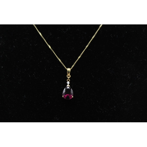 111 - A 9ct gold diamond and gemstone pendant 45cm necklace - approx. gross weight 1.8 grams