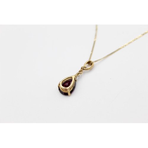 111 - A 9ct gold diamond and gemstone pendant 45cm necklace - approx. gross weight 1.8 grams