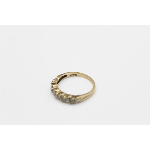 22 - A 9ct gold topaz and diamond set half eternity ring, size O - approx. gross weight 2.3 grams