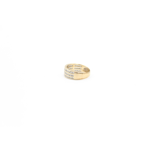 90 - A 9ct gold channel set CZ three row band ring, size J - approx. gross weight 2.3 grams