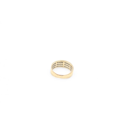 90 - A 9ct gold channel set CZ three row band ring, size J - approx. gross weight 2.3 grams