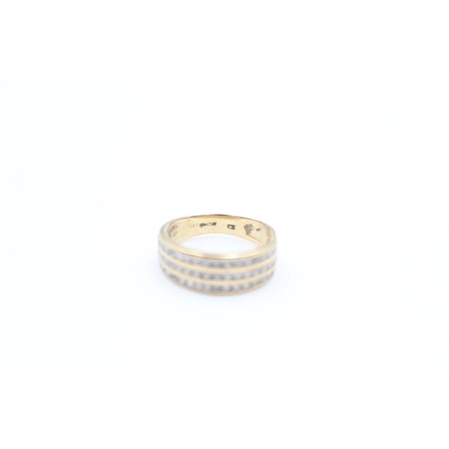 90 - A 9ct gold channel set CZ three row band ring, size J - approx. gross weight 2.3 grams