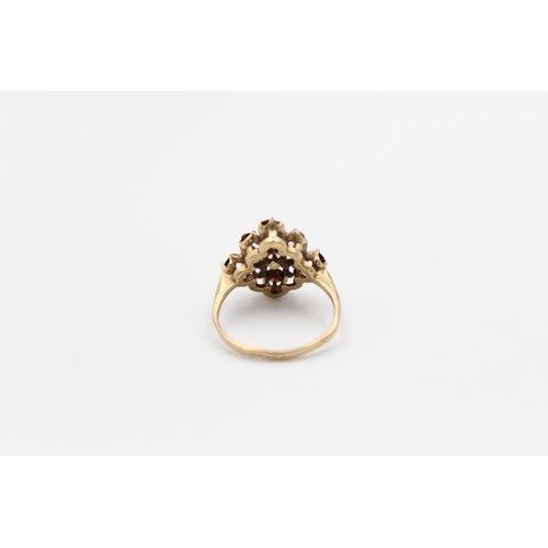 139 - A hallmarked Birmingham 9ct gold garnet and pearl ring, size O ½ - approx. gross weight 3.4 grams