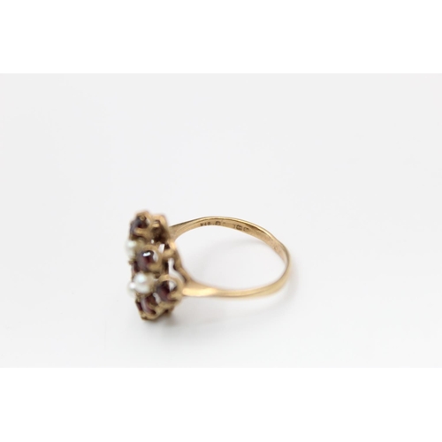 139 - A hallmarked Birmingham 9ct gold garnet and pearl ring, size O ½ - approx. gross weight 3.4 grams