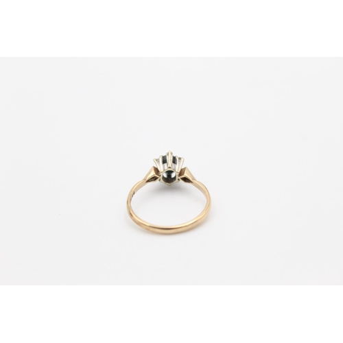 148 - A hallmarked London 9ct gold sapphire and diamond star burst ring, size O½ - approx. gross weight 2.... 