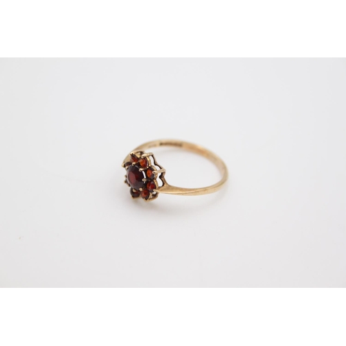 166 - A hallmarked Birmingham 9ct gold garnet cluster ring, size P - approx. gross weight 1.6 grams