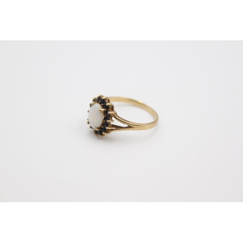 169 - A hallmarked Birmingham 9ct gold opal and sapphire halo set ring, size P - approx. gross weight 2.4 ... 